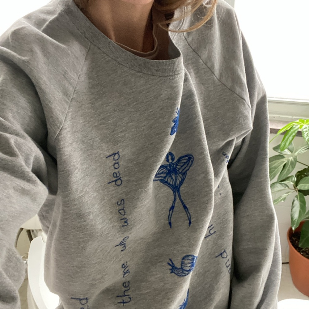 Hand stitched sweatshirt with Saskia Hamilton poem.